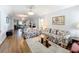 Living room with floral sofas and wood floors at 3754 Wildcat Run, Lakeland, FL 33810