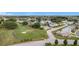 Aerial perspective showcasing homes, golf course, and a serene lake at 3754 Wildcat Run, Lakeland, FL 33810