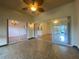 Sunroom with tiled floors, ceiling fan and view of backyard at 4152 Aberdeen Ln, Lake Wales, FL 33859