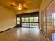 Sunroom with tiled floor, ceiling fan and sliding glass doors at 4152 Aberdeen Ln, Lake Wales, FL 33859