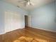 Bedroom with hardwood floors, double door closet and access to bath at 4152 Aberdeen Ln, Lake Wales, FL 33859