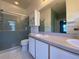 Bathroom with shower, double vanity, and updated fixtures at 4152 Aberdeen Ln, Lake Wales, FL 33859