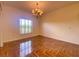 Dining room with hardwood floors and a chandelier at 4152 Aberdeen Ln, Lake Wales, FL 33859
