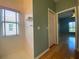 Hallway with wood floors and access to bedroom and bathroom at 4152 Aberdeen Ln, Lake Wales, FL 33859
