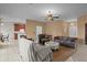 Living room with tiled floors, sofas, and access to other rooms at 4536 Turnberry Ln, Lake Wales, FL 33859