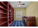 Home office with built-in bookshelves and a writing desk at 4536 Turnberry Ln, Lake Wales, FL 33859