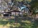 Ranch-style home with carport and fenced yard at 5017 Cornell St, Lakeland, FL 33810