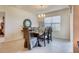 Elegant dining room with a rectangular table and gray upholstered chairs at 535 Noble Ave, Davenport, FL 33837