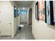 Bright and spacious entryway with tile flooring and modern wall art at 535 Noble Ave, Davenport, FL 33837