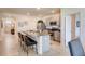 Spacious kitchen with island, granite countertops and stainless steel appliances at 535 Noble Ave, Davenport, FL 33837