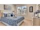 Spacious bedroom with a comfortable queen bed and stylish decor at 535 Noble Ave, Davenport, FL 33837