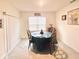 Dining room with round table and four chairs, overlooking a sliding glass door at 535 Noble Ave, Davenport, FL 33837