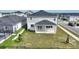Covered patio and fenced backyard with some landscaping at 9660 Westside Hills Dr, Davenport, FL 33896