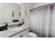 Clean bathroom with granite countertop and shower at 9660 Westside Hills Dr, Davenport, FL 33896