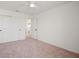 Bedroom with carpet, double door closet and access to another room at 9660 Westside Hills Dr, Davenport, FL 33896