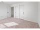 Spacious bedroom with carpeted floor and double door closet at 9660 Westside Hills Dr, Davenport, FL 33896