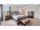 Elegant bedroom with plush upholstered bed and wooden nightstand at 9660 Westside Hills Dr, Davenport, FL 33896
