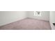 Simple bedroom with carpeted floor and a window at 9660 Westside Hills Dr, Davenport, FL 33896