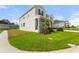 Two-story house with gray siding, stone accents, and a landscaped lawn at 9660 Westside Hills Dr, Davenport, FL 33896