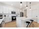 Modern kitchen with white cabinets, island, and stainless steel appliances at 9660 Westside Hills Dr, Davenport, FL 33896