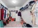 Large walk-in closet with ample shelving and hanging space at 9660 Westside Hills Dr, Davenport, FL 33896