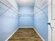 Large walk-in closet with wire shelving and light blue walls at 1015 Joyce Rd, Lake Wales, FL 33853