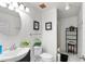 Simple bathroom with a toilet, sink, and shower at 1028 Dampierre Ct, Kissimmee, FL 34759