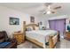 Spacious bedroom with a king-size bed and ceiling fan at 1028 Dampierre Ct, Kissimmee, FL 34759