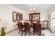 Formal dining room with wood table, chandelier, and china cabinet at 1028 Dampierre Ct, Kissimmee, FL 34759