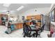 Kitchen features wood cabinets, stainless steel appliances, and a breakfast bar at 1028 Dampierre Ct, Kissimmee, FL 34759