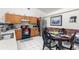 Bright kitchen features wood cabinets, appliances, and a breakfast nook at 1028 Dampierre Ct, Kissimmee, FL 34759
