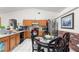 Kitchen with wood cabinets, stainless steel appliances and breakfast nook at 1028 Dampierre Ct, Kissimmee, FL 34759