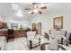 Kitchen with wood cabinets, breakfast nook and view into living room at 1028 Dampierre Ct, Kissimmee, FL 34759