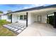 Modern home exterior with covered entryway and walkway at 105 Elliott Ln, Winter Haven, FL 33884