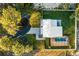 Aerial view showing a house, pool, and driveway at 128 Caloosa Dr, Babson Park, FL 33827