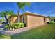 House exterior showcasing a side view with lush landscaping at 1392 Innsbruck Ct, Winter Haven, FL 33884