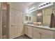 Bathroom with double sinks, granite countertop and a shower at 1644 Linz Ct, Winter Haven, FL 33884