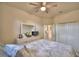 Bedroom with queen bed, dresser, and access to bathroom at 1644 Linz Ct, Winter Haven, FL 33884