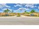 Vienna Square community entrance with gated access, landscaping, and palm trees at 1644 Linz Ct, Winter Haven, FL 33884