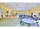 Large community room with tables, chairs, and a dance floor at 1644 Linz Ct, Winter Haven, FL 33884