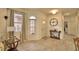 Light and airy entryway with wood-look floors, a console table, and ample natural light at 1644 Linz Ct, Winter Haven, FL 33884
