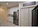 Kitchen features white cabinets, stainless steel appliances, and pantry at 1644 Linz Ct, Winter Haven, FL 33884