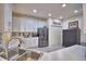 White kitchen cabinets, stainless steel appliances and an island at 1644 Linz Ct, Winter Haven, FL 33884