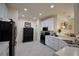 Modern kitchen with white cabinets, stainless steel appliances, and an island at 1644 Linz Ct, Winter Haven, FL 33884