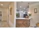 Modern kitchen with white cabinets, stainless steel appliances, and a breakfast bar at 1644 Linz Ct, Winter Haven, FL 33884