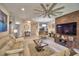 Elegant living room with a large sectional sofa and a statement wall at 1644 Linz Ct, Winter Haven, FL 33884
