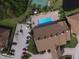 Community pool with a tennis court and lush landscaping at 1644 Linz Ct, Winter Haven, FL 33884