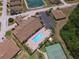 Community pool, spa, and tennis court at 1644 Linz Ct, Winter Haven, FL 33884