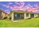 Relaxing screened patio with outdoor furniture and grill, perfect for entertaining at 1644 Linz Ct, Winter Haven, FL 33884