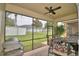 Spacious screened patio with seating area, grill, and backyard view at 1644 Linz Ct, Winter Haven, FL 33884